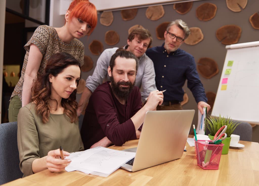 A cross-functional team reviewing product work together